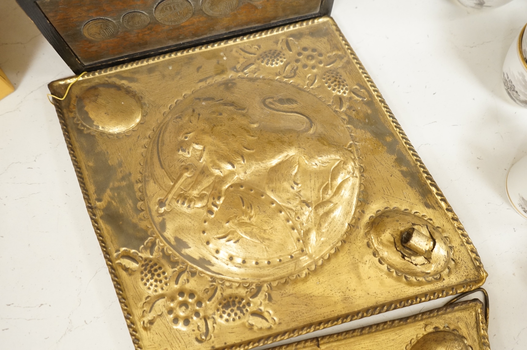 A Victorian glass spirit barrel, converted to a lamp base, together with a pair of embossed sheet-brass heraldic plaques and a replica coin set box